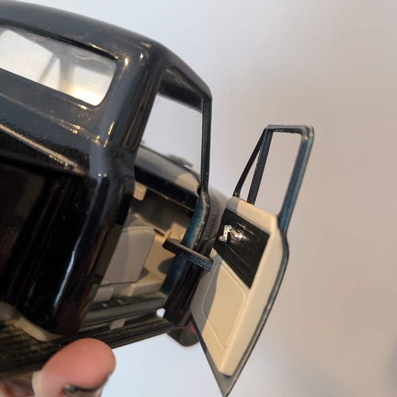 Classic Black Toy Truck with Red Wheels - Picture 9 of 11